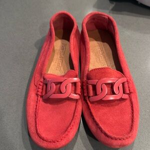 Never worn. Red suede loafers. Plastic red buckle